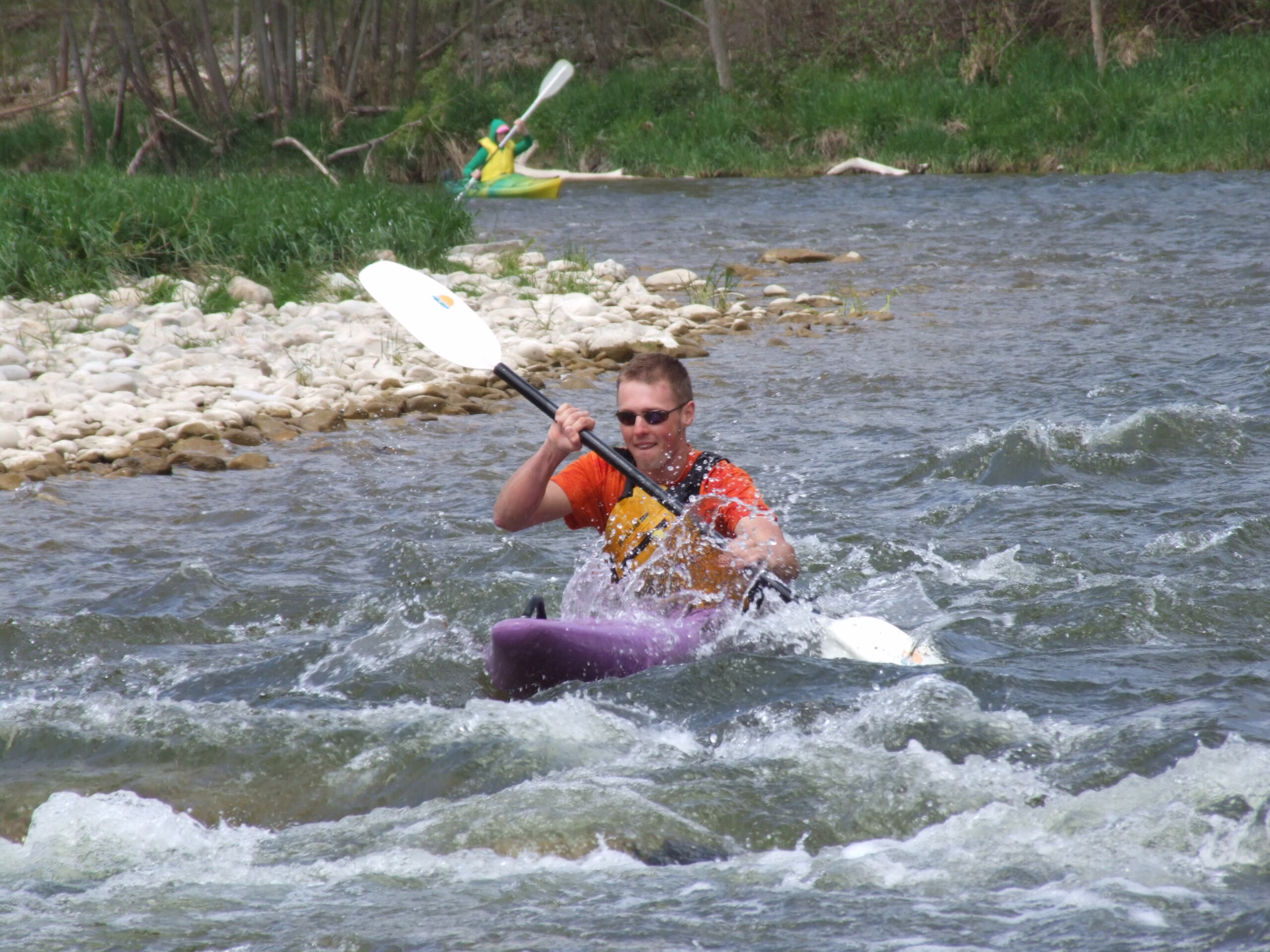 paddling hard in whitewater