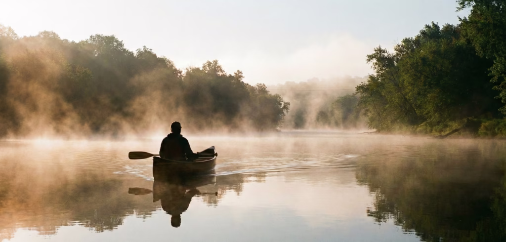Solo paddler in the morning mist