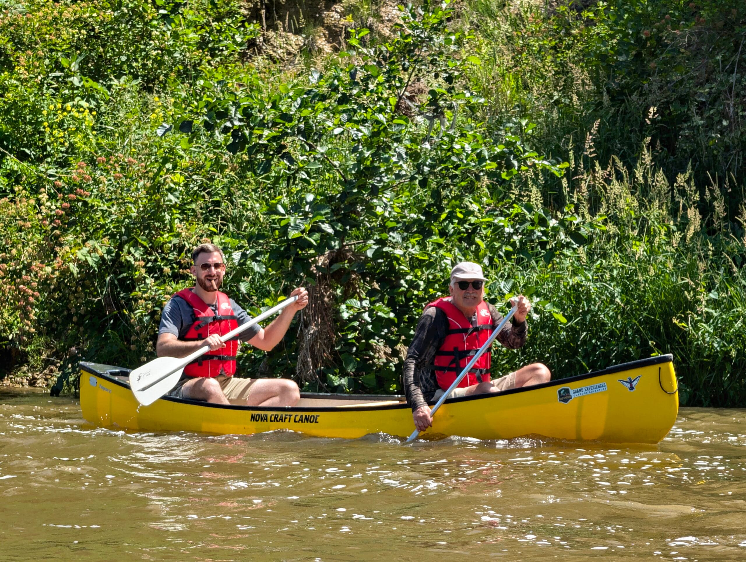 Father and son enjoying a fathers day paddle on the grand river in paris ontario