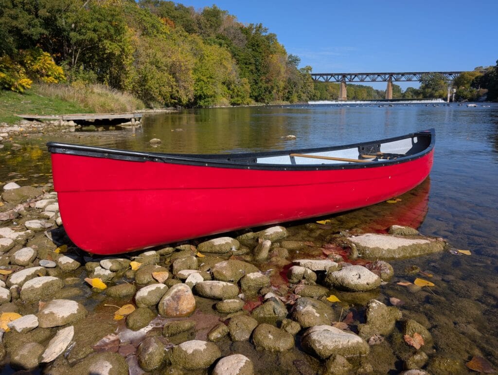 Canoe in front of iconic penmans dam in paris ontario