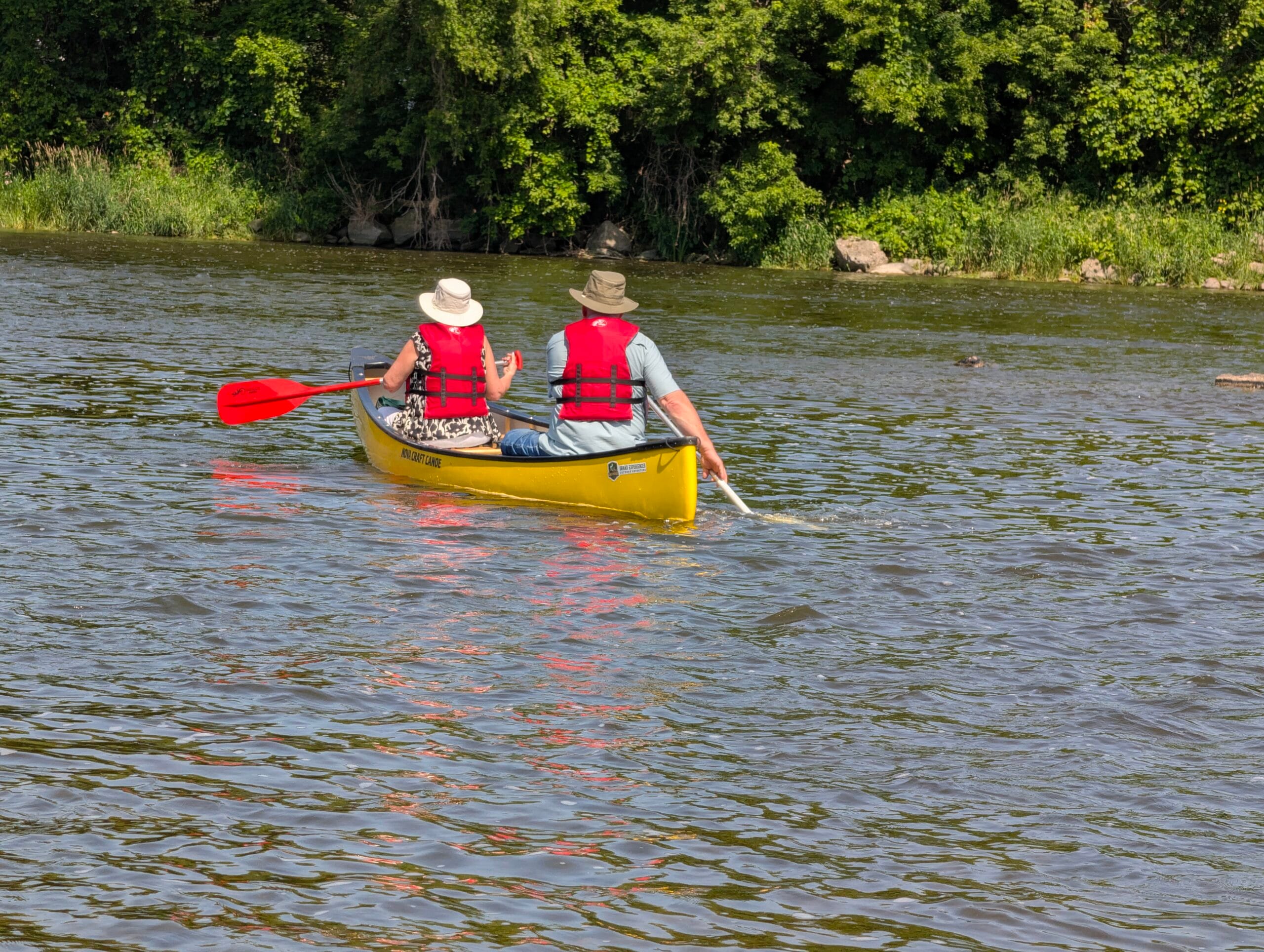 Older couple enjoying a canoe trip on the grand river