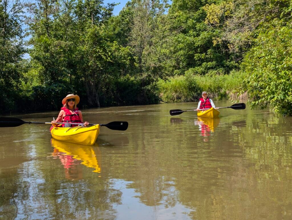 Two guests paddling big creek