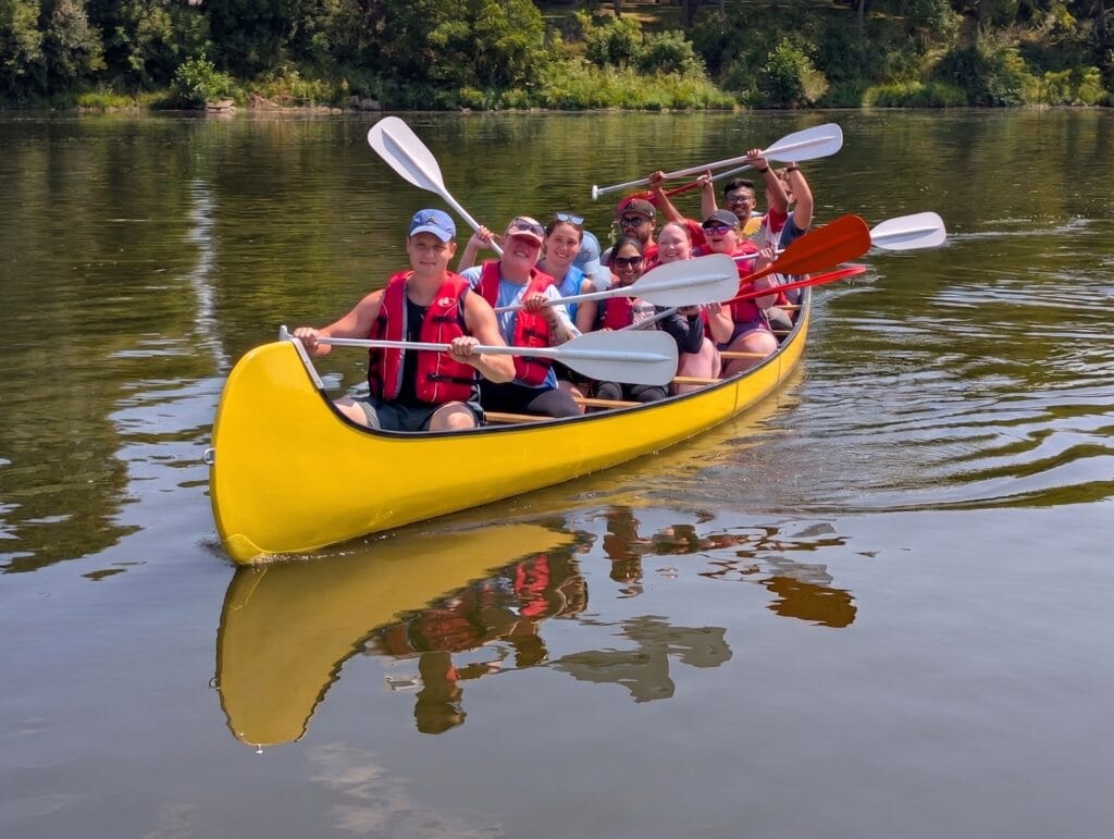 Updated voyageur canoes corporate group at River bluffs park in cambridge