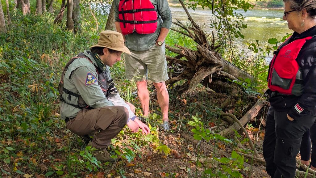 Adam Shoalts demonstrating the uses of local flora and fauna