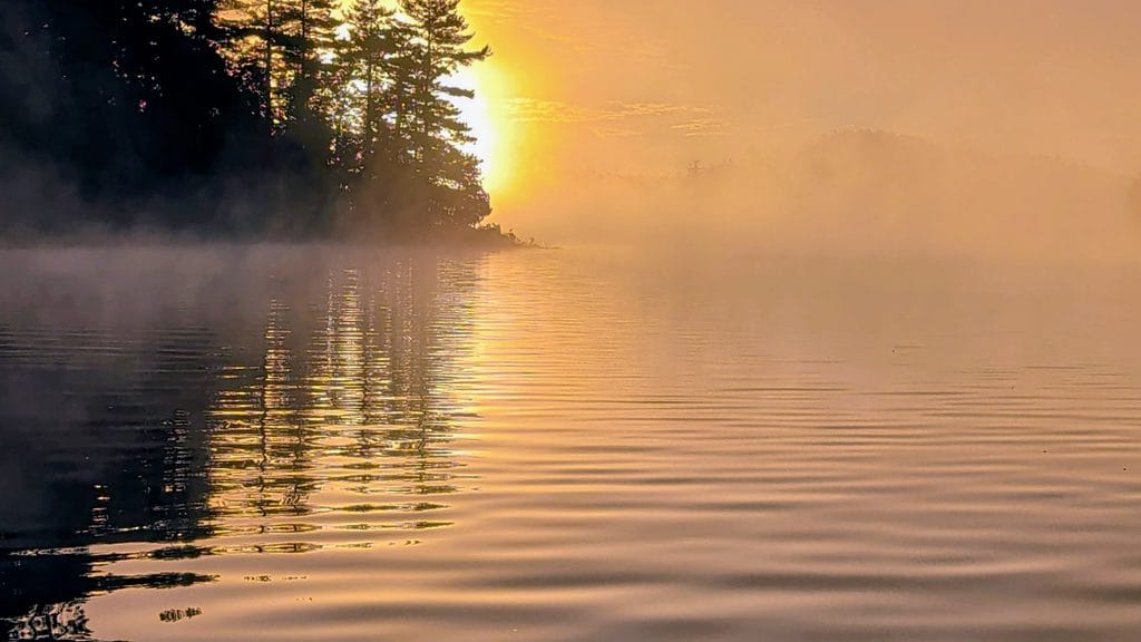 Automn morning mist at sunrise on french river