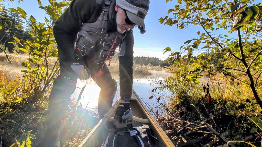 Pulling the canoe over a beaver dam