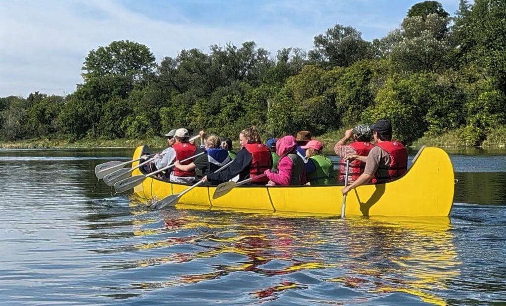 School group on a voyageur canoe